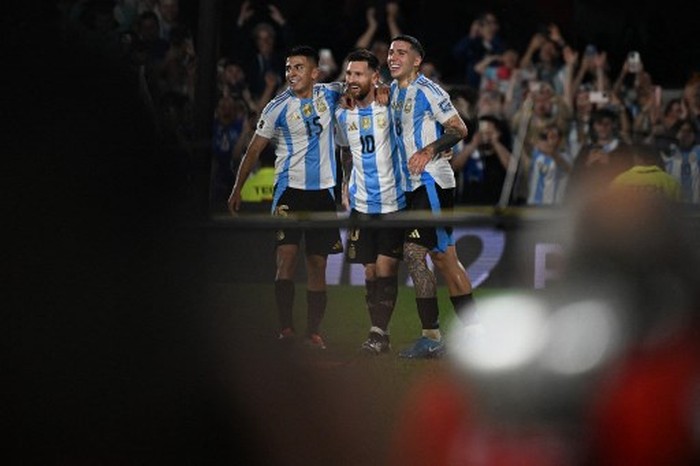 Lionel Messi Argentinas forward #10 Lionel Messi celebrates with Argentinas midfielder #15 Thiago Almada and Argentinas midfielder #18 Nico Paz after scoring during the 2026 FIFA World Cup South American qualifiers football match between Argentina and Bolivia at the Mas Monumental stadium in Buenos Aires on October 15, 2024. (Photo by Luis ROBAYO / AFP)