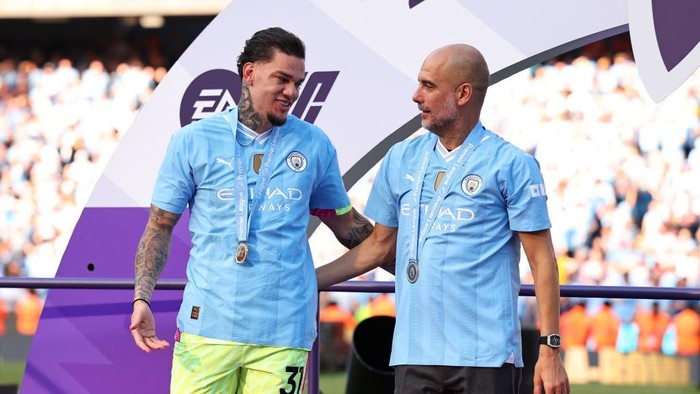 MANCHESTER, ENGLAND - MAY 19: Ederson and Pep Guardiola the head coach / manager of Manchester City during the Premier League match between Manchester City and West Ham United at Etihad Stadium on May 19, 2024 in Manchester, England.(Photo by Robbie Jay Barratt - AMA/Getty Images)