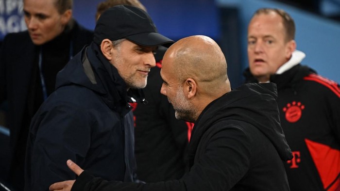 Manchester Citys Spanish manager Pep Guardiola (R) greets Bayern Munichs German head coach Thomas Tuchel (L) ahead of kick-off in the UEFA Champions League quarter final, first leg football match between Manchester City and Bayern Munich at the Etihad Stadium in Manchester, north-west England, on April 11, 2023. (Photo by Paul ELLIS / AFP)