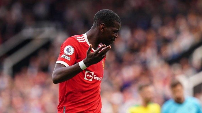 Manchester Uniteds Paul Pogba (right) reacts after a head collision during the Premier League match at Old Trafford, Manchester. Picture date: Saturday April 16, 2022. (Photo by Martin Rickett/PA Images via Getty Images)