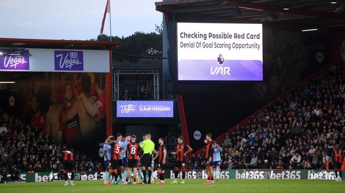 BOURNEMOUTH, ENGLAND - OCTOBER 19: A general view of an LED board displaying a VAR review message, checking possible red card, during the Premier League match between AFC Bournemouth and Arsenal FC at Vitality Stadium on October 19, 2024 in Bournemouth, England. (Photo by Mike Hewitt/Getty Images)