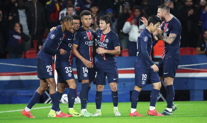 PARIS, FRANCE - OCTOBER 19: Warren Zaire-Emery #33 of Paris Saint-Germain celebrate his first goal with teammates during the Ligue 1 McDonald's match between Paris Saint-Germain and RC Strasbourg Alsace at Parc des Princes Stadium on October 19, 2024 in Paris, France. (Photo by Xavier Laine/Getty Images)