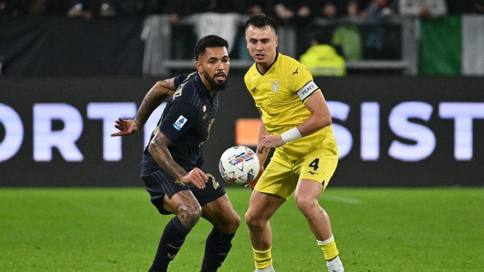 Douglas Luiz of Juventus F.C. and Patric of S.S. Lazio are in action during the 8th day of the Serie A Championship between Juventus F.C. and S.S. Lazio at Allianz Stadium in Turin, Italy, on October 19, 2024. (Photo by Domenico Cippitelli/NurPhoto via Getty Images)