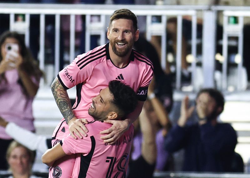 FORT LAUDERDALE, FLORIDA - OCTOBER 19: Lionel Messi #10 of Inter Miami celebrates with Jordi Alba #18 after scoring his second goal during the second half against the New England Revolution at Chase Stadium on October 19, 2024 in Fort Lauderdale, Florida. (Photo by Carmen Mandato/Getty Images)