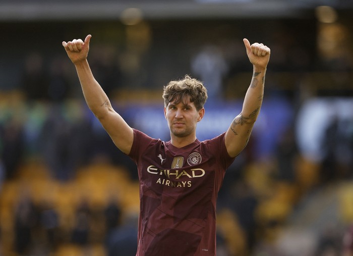 John Stones Soccer Football - Premier League - Wolverhampton Wanderers v Manchester City - Molineux Stadium, Wolverhampton, Britain - October 20, 2024 Manchester City's John Stones celebrates after the match Action Images via Reuters/Jason Cairnduff EDITORIAL USE ONLY. NO USE WITH UNAUTHORIZED AUDIO, VIDEO, DATA, FIXTURE LISTS, CLUB/LEAGUE LOGOS OR 'LIVE' SERVICES. ONLINE IN-MATCH USE LIMITED TO 120 IMAGES, NO VIDEO EMULATION. NO USE IN BETTING, GAMES OR SINGLE CLUB/LEAGUE/PLAYER PUBLICATIONS. PLEASE CONTACT YOUR ACCOUNT REPRESENTATIVE FOR FURTHER DETAILS..