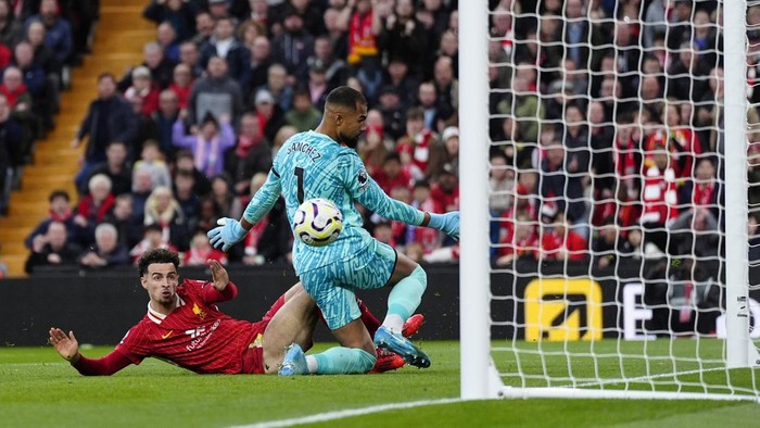 Liverpools Curtis Jones (left) scores their sides first goal of the game during the Premier League match at Anfield, Liverpool. Picture date: Sunday October 20, 2024. (Photo by Peter Byrne/PA Images via Getty Images)