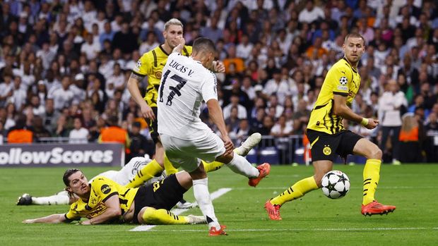 Soccer Football - Champions League - Real Madrid v Borussia Dortmund - Santiago Bernabeu, Madrid, Spain - October 22, 2024 Real Madrid's Lucas Vazquez scores their third goal REUTERS/Susana Vera