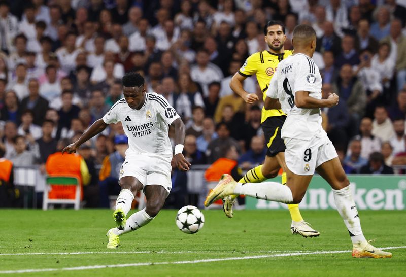 Soccer Football - Champions League - Real Madrid v Borussia Dortmund - Santiago Bernabeu, Madrid, Spain - October 22, 2024 Real Madrid's Vinicius Junior scores their fourth goal REUTERS/Susana Vera
