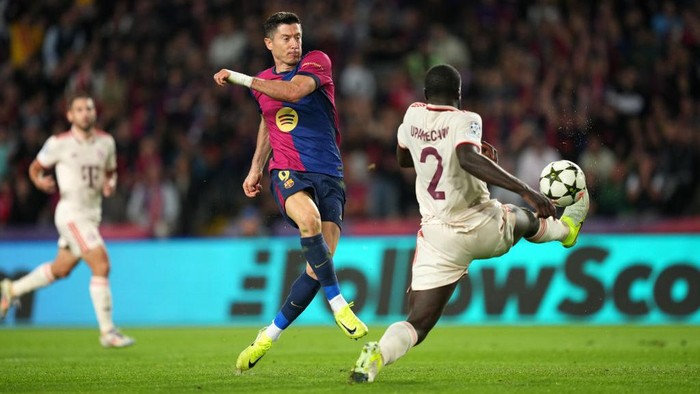 BARCELONA, SPAIN - OCTOBER 23: Robert Lewandowski of FC Barcelona scores his teams second goal during the UEFA Champions League 2024/25 League Phase MD3 match between FC Barcelona and FC Bayern Munchen at Estadi Olimpic Lluis Companys on October 23, 2024 in Barcelona, Spain. (Photo by Alex Caparros - UEFA/UEFA via Getty Images)