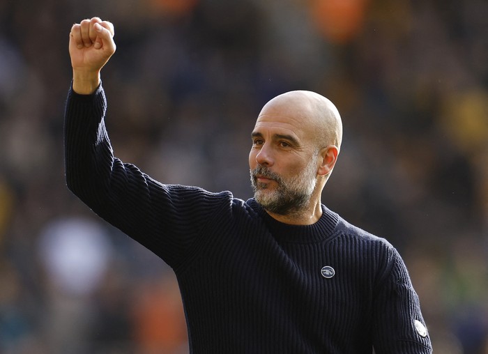 Soccer Football - Premier League - Wolverhampton Wanderers v Manchester City - Molineux Stadium, Wolverhampton, Britain - October 20, 2024 Manchester City manager Pep Guardiola celebrates after the match Action Images via Reuters/Jason Cairnduff EDITORIAL USE ONLY. NO USE WITH UNAUTHORIZED AUDIO, VIDEO, DATA, FIXTURE LISTS, CLUB/LEAGUE LOGOS OR LIVE SERVICES. ONLINE IN-MATCH USE LIMITED TO 120 IMAGES, NO VIDEO EMULATION. NO USE IN BETTING, GAMES OR SINGLE CLUB/LEAGUE/PLAYER PUBLICATIONS. PLEASE CONTACT YOUR ACCOUNT REPRESENTATIVE FOR FURTHER DETAILS..