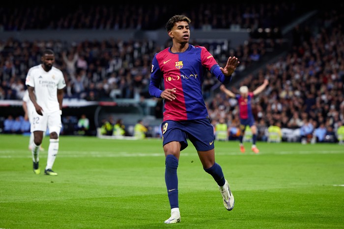 MADRID, SPAIN - OCTOBER 26: Lamine Yamal of FC Barcelona celebrates after scoring their sides third goal during the LaLiga match between Real Madrid CF and FC Barcelona at Estadio Santiago Bernabeu on October 26, 2024 in Madrid, Spain. (Photo by Alvaro Medranda/Quality Sport Images/Getty Images)