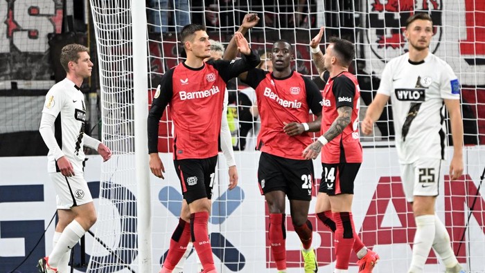 29 October 2024, North Rhine-Westphalia, Leverkusen: Soccer: DFB-Pokal, Bayer Leverkusen - SV Elversberg, 2nd round, in the BayArena, Leverkusens Patrik Schick (l-r) Nordi Mukiele and Aleix Garcia celebrate the 2:0 goal. Photo: Federico Gambarini/dpa - IMPORTANT NOTE: In accordance with the regulations of the DFL German Football League and the DFB German Football Association, it is prohibited to utilize or have utilized photographs taken in the stadium and/or of the match in the form of sequential images and/or video-like photo series. (Photo by Federico Gambarini/picture alliance via Getty Images)