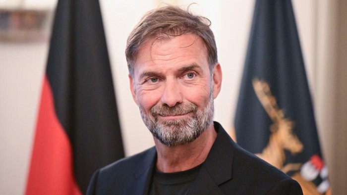 Juergen Klopp 08 October 2024, Baden-Württemberg, Stuttgart: Soccer coach Jürgen Klopp receives the Order of Merit of the State of Baden-Württemberg. Born in Stuttgart, he received the award for his wide-ranging social commitment outside of sport. Photo: Bernd Weißbrod/dpa (Photo by Bernd Weißbrod/picture alliance via Getty Images)