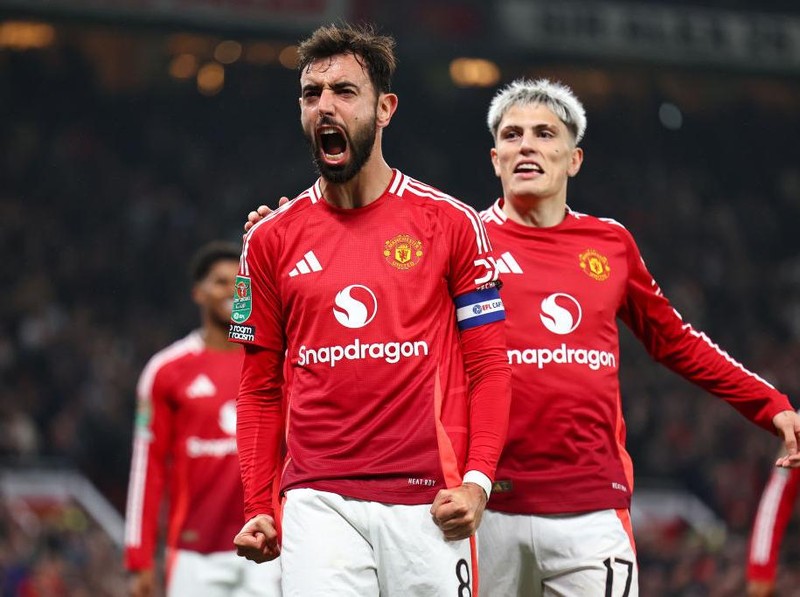 MANCHESTER, ENGLAND - OCTOBER 30: Bruno Fernandes of Manchester United celebrates after scoring a goal to make it 5-2 during the Carabao Cup Fourth Round match between Manchester United and Leicester City   at Old Trafford on October 30, 2024 in Manchester, England. (Photo by Robbie Jay Barratt - AMA/Getty Images)