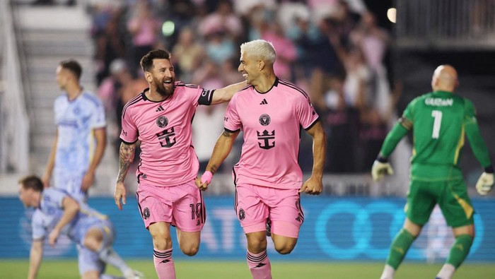 Oct 25, 2024; Fort Lauderdale, Florida, USA; Inter Miami CF forward Lionel Messi (10) and Inter Miami CF forward Luis Suarez (9) celebrate a first half goal by Suarez against Atlanta United in a 2024 MLS Cup Playoffs Round One match  at Chase Stadium. Mandatory Credit: Sam Navarro-Imagn Images     TPX IMAGES OF THE DAY