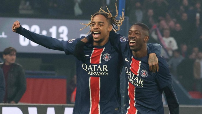 PARIS, FRANCE - NOVEMBER 02: Ousmane Dembele (R) #10 of Paris Saint-Germain celebrates his first goal with Bradley Barcola #29 (L) during the Ligue 1 McDonalds match between Paris Saint-Germain and Racing Club de Lens at Parc des Princes Stadium on November 02, 2024 in Paris, France. (Photo by Xavier Laine/Getty Images)