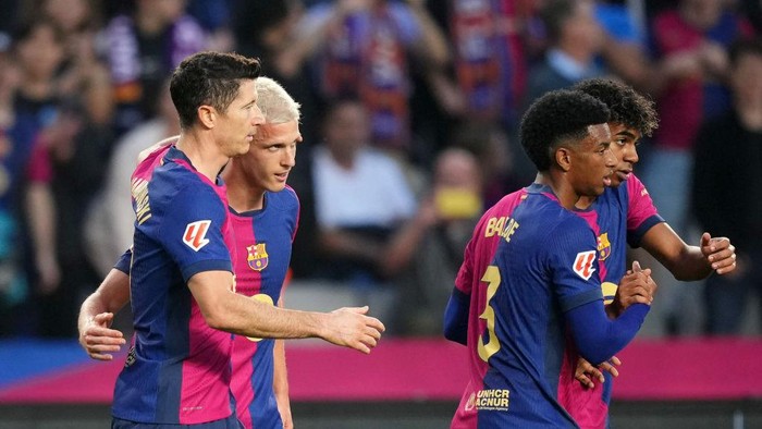 BARCELONA, SPAIN - NOVEMBER 03: Dani Olmo of FC Barcelona celebrates scoring his teams first goal with teammates during the La Liga EA Sports match between FC Barcelona and RCD Espanyol at Estadi Olimpic Lluis Companys on November 03, 2024 in Barcelona, Spain. (Photo by Alex Caparros/Getty Images)