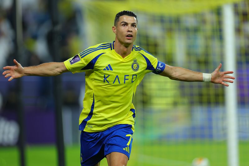 RIYADH, SAUDI ARABIA - NOVEMBER 05: Cristiano Ronaldo celebrates after scoring the second of his team goal during the AFC Champions League Elite match between Al-Nassr FC and Al Ain FC at Al-Awaal Park on November 05, 2024 in Riyadh, Saudi Arabia. (Photo by Al Nassr FC/Al Nassr FC via Getty Images)