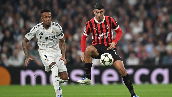 MADRID, SPAIN - NOVEMBER 05: Alvaro Morata of AC Milan controls the ball whilst under pressure from Eder Militao of Real Madrid during the UEFA Champions League 2024/25 League Phase MD4 match between Real Madrid C.F. and AC Milan at Estadio Santiago Bernabeu on November 05, 2024 in Madrid, Spain. (Photo by Michael Regan - UEFA/UEFA via Getty Images)