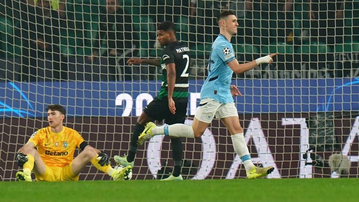  Phil Foden of Manchester City celebrates scoring his team's first goal during the UEFA Champions League 2024/25 League Phase MD4 match between Sporting Clube de Portugal and Manchester City at Estadio Jose Alvalade on November 05, 2024 in Lisbon, Portugal. (Photo by Gualter Fatia/Getty Images)