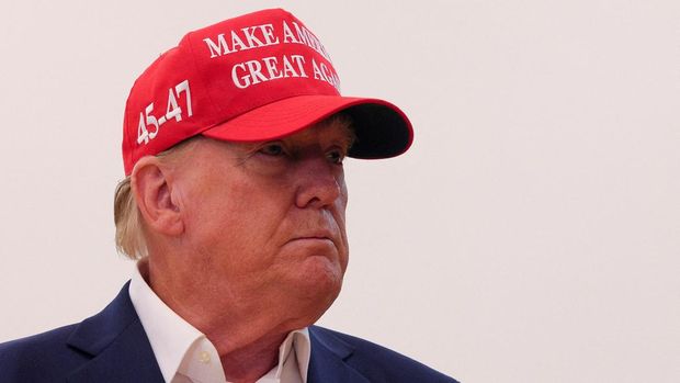 Republican presidential nominee and former U.S. President Donald Trump wears an 
