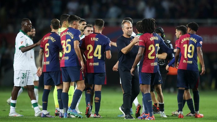 BARCELONA, SPAIN - SEPTEMBER 25: Hansi Flick, Head Coach of FC Barcelona, shakes hands with Jules Kounde of FC Barcelona following the teams victory during the La Liga EA Sports match between FC Barcelona and Getafe CF at Camp Nou on September 25, 2024 in Barcelona, Spain. (Photo by Linnea Rheborg/Getty Images)