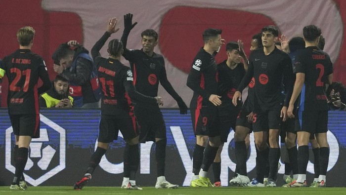 Barcelona players celebrate after a goal during the Champions League opening phase soccer match between Red Star and Barcelona at the Rajko Mitic Stadium in Belgrade, Serbia, Wednesday, Nov. 6, 2024. (AP Photo/Darko Vojinovic)