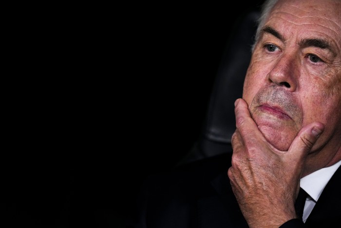 Real Madrids head coach Carlo Ancelotti sits at the bench prior to the Champions League opening phase soccer match between Real Madrid and Borussia Dortmund at the Santiago Bernabeu stadium in Madrid, Tuesday, Oct. 22, 2024. Real Madrid won 5-2. (AP Photo/Manu Fernandez)