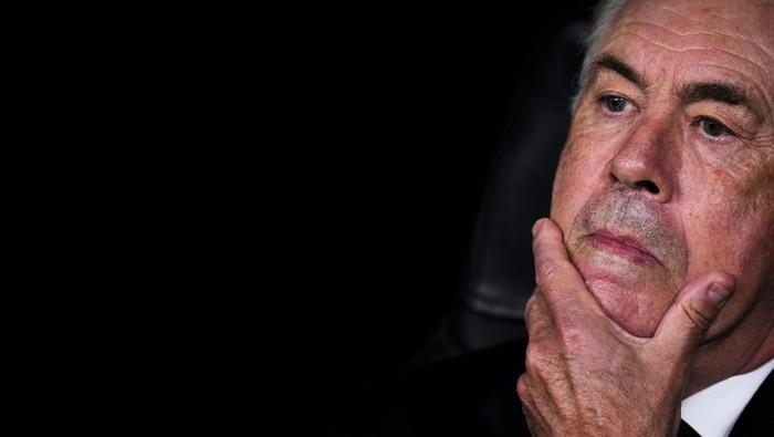 Real Madrids head coach Carlo Ancelotti sits at the bench prior to the Champions League opening phase soccer match between Real Madrid and Borussia Dortmund at the Santiago Bernabeu stadium in Madrid, Tuesday, Oct. 22, 2024. Real Madrid won 5-2. (AP Photo/Manu Fernandez)