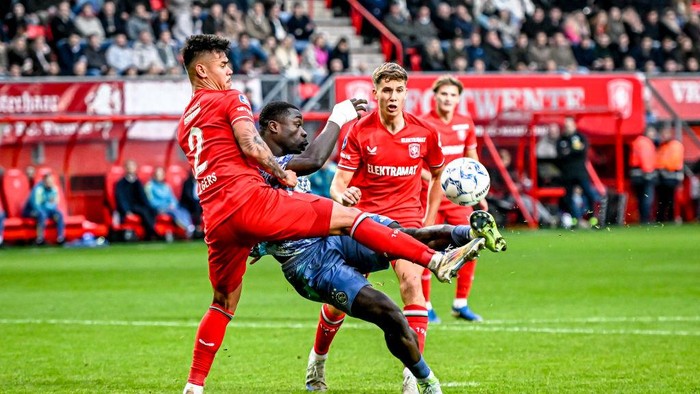 FC Twente defender Mees Hilgers and AFC Ajax Amsterdam forward Brian Brobbey play during the match between Twente and Ajax at the Grolsch Veste stadium for the Dutch Eredivisie season 2024-2025 in Enschede, Netherlands, on November 10, 2024. (Photo by Stefan Koops / EYE4images) (Photo by EYE4images/NurPhoto via Getty Images)