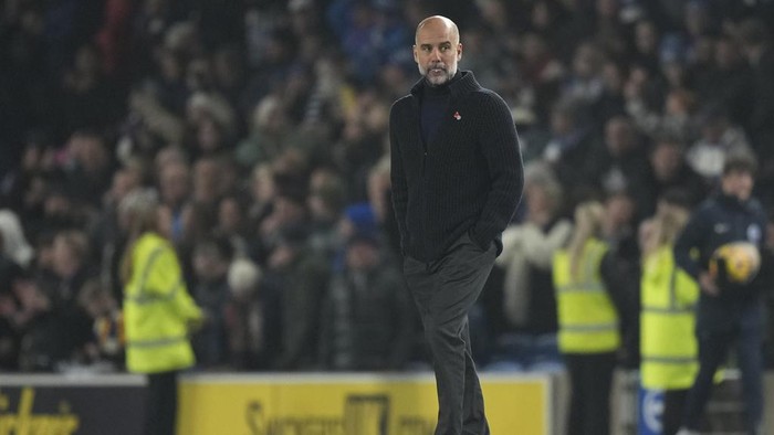 Manchester Citys head coach Pep Guardiola leaves the pitch after the English Premier League soccer match between Brighton and Manchester City at Falmer Stadium in Brighton, England, Saturday, Nov. 9, 2024. (AP Photo/Alastair Grant)