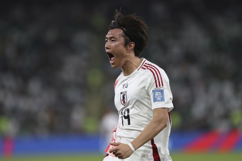 Japan's Koki Ogawa celebrates during the World Cup 2026 qualifier soccer match between Japan and Saudi Arabia at the King Abdullah Sports City, in Jeddah, Saudi Arabia, Thursday, Oct. 10, 2024. (AP Photo)