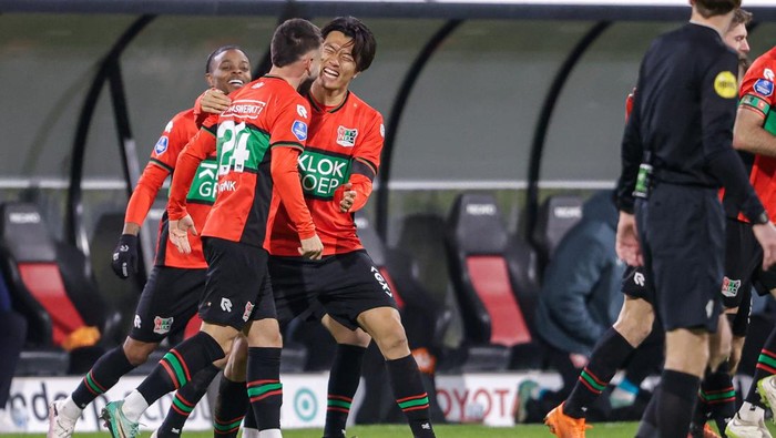 NIJMEGEN, NETHERLANDS - JANUARY 20: Koki Ogawa of NEC, Calvin Verdonk of NEC celebrates after scoring his teams first goal, Sontje Hansen of NEC during the Dutch Eredivisie match between NEC and FC Twente at Goffertstadion on January 20, 2024 in Nijmegen, Netherlands. (Photo by Broer van den Boom/BSR Agency/Getty Images)