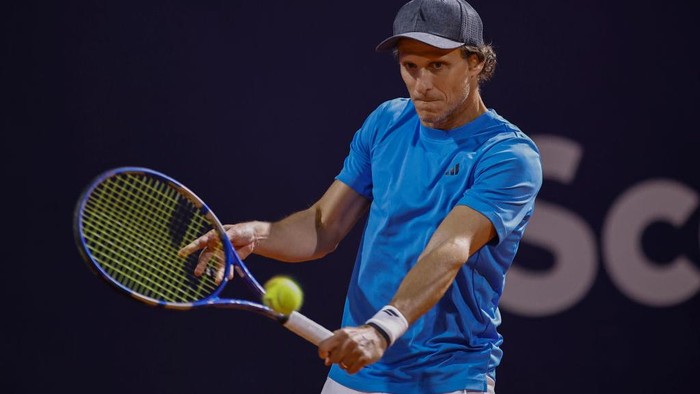 MONTEVIDEO, URUGUAY - NOVEMBER 13: Diego Forlan (R), the 45-year-old former Manchester United, Uruguay, and Atletico Madrid footballer playing in his pro tennis debut, and doubles teammate Federico Coria pose after their match at the 2024 Uruguay Open at Carrasco Lawn Tennis Club on November 13, 2024 in Montevideo, Uruguay. (Photo by Ernesto Ryan/Getty Images)