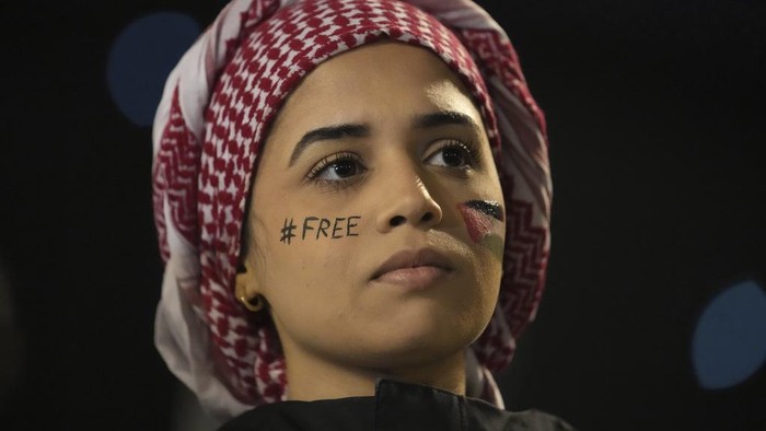 A demonstrator attends a rally in support of the Palestinian people, ahead of the Nations League soccer match France against Israel, Thursday, Nov. 14, 2024 in Saint-Denis, outside Paris. (AP Photo/Christophe Ena)