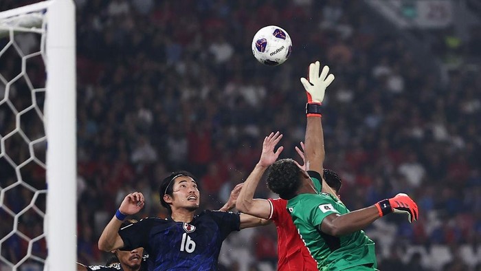 JAKARTA, INDONESIA - NOVEMBER 15: Goalkeeper Zion Suzuki of Japan defends an attempt by Indonesia in the second half during the FIFA World Cup Asian 3rd Qualifier Group C match at Gelora Bung Karno Stadium on November 15, 2024 in Jakarta, Indonesia.  (Photo by Robertus Pudyanto/Getty Images)