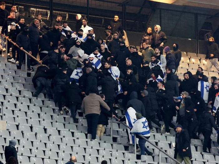 PARIS, FRANCE - NOVEMBER 14: Fans of Team Israel fight during the UEFA Nations League 2024/25 League A Group A2 match between France and Israel at Stade de France on November 14, 2024 in Paris, France. (Photo by Xavier Laine/Getty Images)