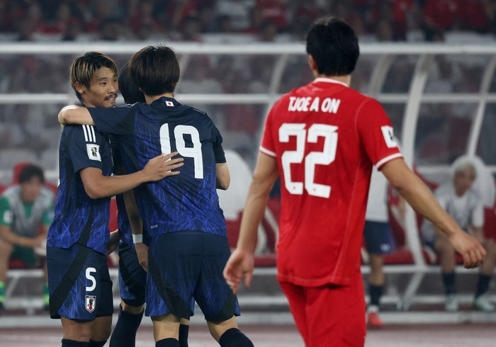 Soccer Football - World Cup - Asian Qualifiers - Third Round - Group C - Indonesia v Japan - Gelora Bung Karno Main Stadium, Jakarta, Indonesia - November 15, 2024  Japans Hidemasa Morita celebrates scoring their third goal with teammates REUTERS/Ajeng Dinar Ulfiana