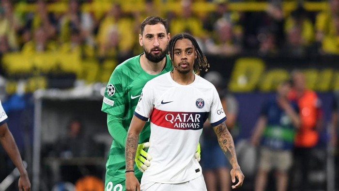 DORTMUND, GERMANY - MAY 1: goalkeeper Gianluigi Donnarumma of Paris Saint-Germain and Bradley Barcola of Paris Saint-Germain look on during the UEFA Champions League semi-final first leg match between Borussia Dortmund and Paris Saint-Germain at Signal Iduna Park on May 1, 2024 in Dortmund, Germany. (Photo by Ralf Treese/DeFodi Images via Getty Images)