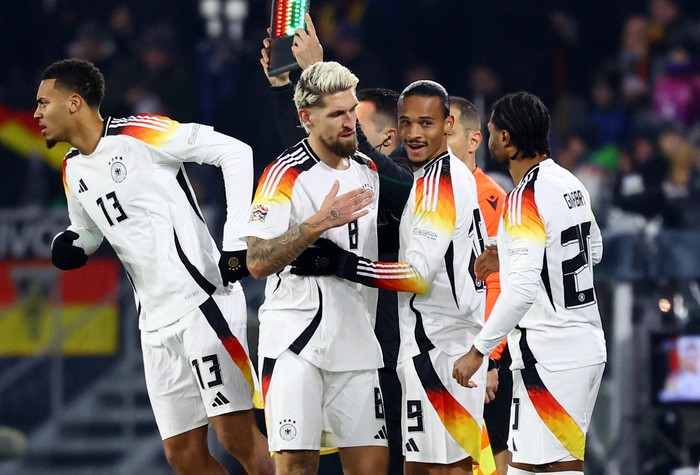 Soccer Football - Nations League - Group Stage - Germany v Bosnia and Herzegovina - Europa Park Stadion, Freiburg, Germany - November 16, 2024 Germanys Leroy Sane and Serge Gnabry get ready to come on as substitutes as Robert Andrich comes off REUTERS/Kai Pfaffenbach