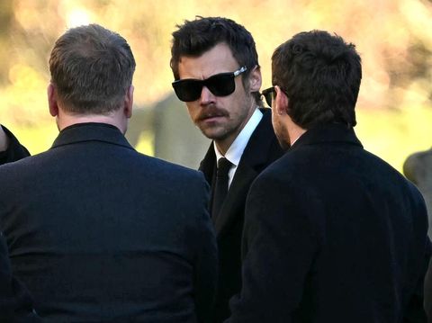 Former One Direction band members Harry Styles (C) and Niall Horan leave after attending the funeral service of the late One Direction singer Liam Payne, at a St Mary's church in Amersham, west of London on November 20, 2024. The funeral of former One Direction singer Liam Payne who died last month after falling from his Buenos Aires hotel room was held on Wednesday. (Photo by JUSTIN TALLIS / AFP)