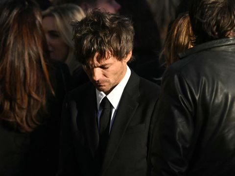 Former One Direction band member Louis Tomlinson leaves after attending the funeral service of the late One Direction singer Liam Payne, at a St Mary's church in Amersham, west of London on November 20, 2024. The funeral of former One Direction singer Liam Payne who died last month after falling from his Buenos Aires hotel room was held on Wednesday. (Photo by JUSTIN TALLIS / AFP)