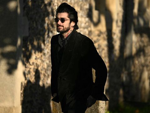 Former One Direction band member Zayn Malik leaves after attending the funeral service of the late One Direction singer Liam Payne, at a St Mary's church in Amersham, west of London on November 20, 2024. The funeral of former One Direction singer Liam Payne who died last month after falling from his Buenos Aires hotel room was held on Wednesday. (Photo by JUSTIN TALLIS / AFP)