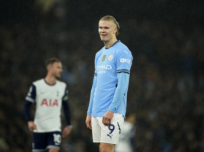 Manchester City's Erling Haaland reacts in front of Tottenham's James Maddison during the English Premier League soccer match between Manchester City and Tottenham at the Etihad Stadium in Manchester, England, Sunday, Nov. 24, 2024. (AP Photo/Dave Thompson)