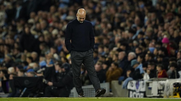 Manchester Citys head coach Pep Guardiola walks on the touchline during the English Premier League soccer match between Manchester City and Tottenham at the Etihad Stadium in Manchester, England, Sunday, Nov. 24, 2024. (AP Photo/Dave Thompson)