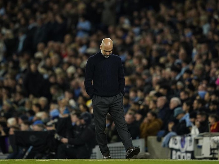 Manchester Citys head coach Pep Guardiola walks on the touchline during the English Premier League soccer match between Manchester City and Tottenham at the Etihad Stadium in Manchester, England, Sunday, Nov. 24, 2024. (AP Photo/Dave Thompson)