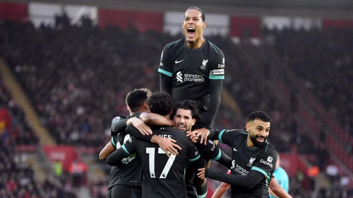 Liverpools Dominik Szoboszlai (centre) celebrates scoring their sides first goal of the game with teammates during the Premier League match at St Marys Stadium, Southampton. Picture date: Sunday November 24, 2024. (Photo by Adam Davy/PA Images via Getty Images)