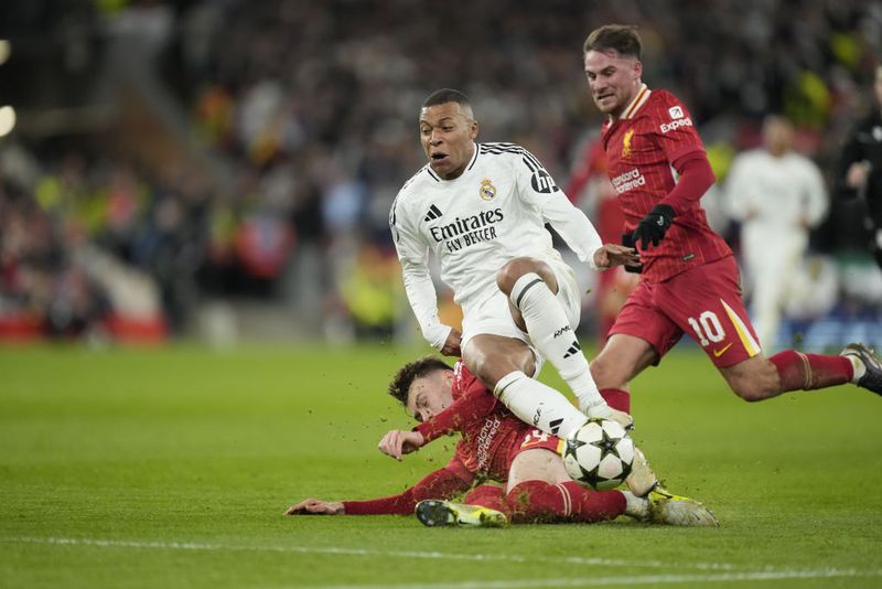 LIVERPOOL, ENGLAND - NOVEMBER 27: Kylian Mbappe centre-forward of Real Madrid and France and Conor Bradley right-back of Liverpool and Northern Ireland compete for the ball during the UEFA Champions League 2024/25 League Phase MD5 match between Liverpool FC and Real Madrid C.F. at Anfield on November 27, 2024 in Liverpool, England. (Photo by Jose Hernandez/Anadolu via Getty Images)