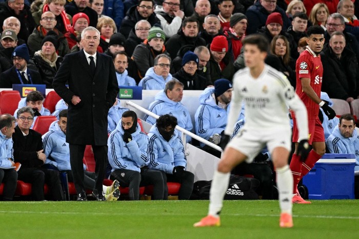 Real Madrids Italian coach Carlo Ancelotti watches the players from the touchline during the UEFA Champions League football match between Liverpool and Real Madrid at Anfield in Liverpool, north west England on November 27, 2024. (Photo by Oli SCARFF / AFP)