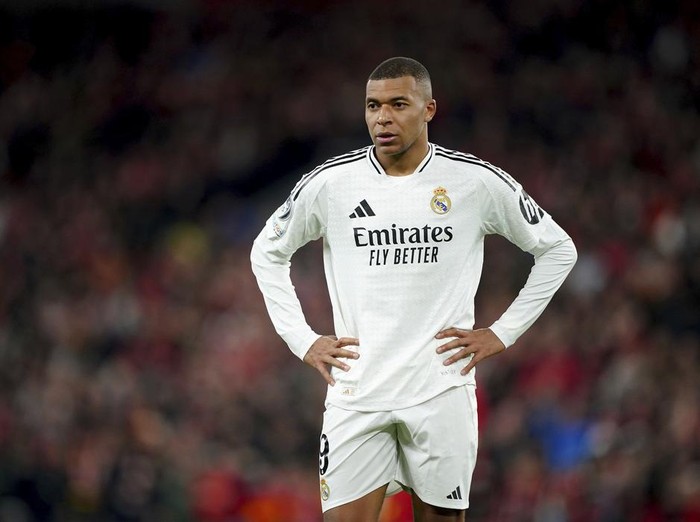 Real Madrid's Kylian Mbappe stands on the pitch during the Champions League opening phase soccer match between Liverpool and Real Madrid at Anfield Stadium, Liverpool, England, Wednesday, Nov. 27, 2024.  (Peter Byrne/PA via AP)